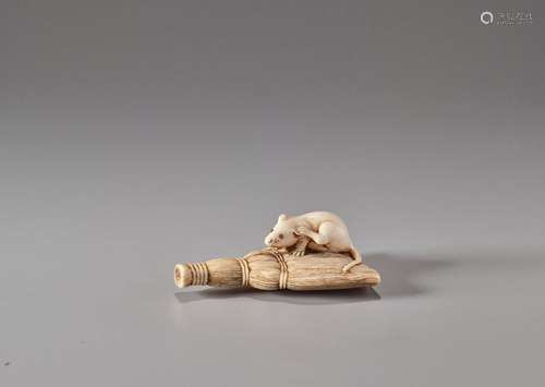 AN IVORY NETSUKE OF A RAT ON A BROOM Unsigned Japa…