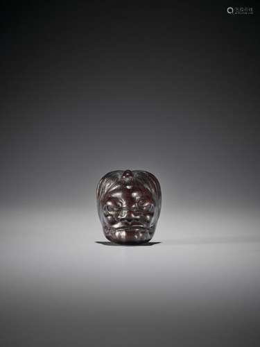 A FINE SHITAN WOOD MASK NETSUKE OF IKKAKU SENNIN U…