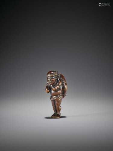 A RARE WOOD NETSUKE OF A FISHERMAN WITH FUGU Unsig…