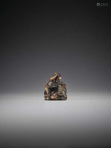 HOSHUNSAI MASAYUKI: A RARE WOOD NETSUKE OF A YOUNG…