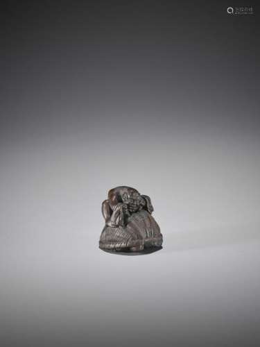 ALEXANDER DERKACHENKO: A BOXWOOD NETSUKE OF ONI WI…