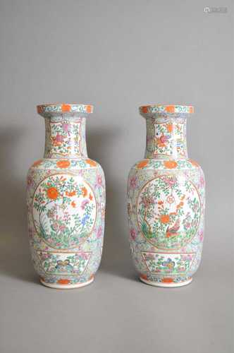 A pair of Chinese porcelain famille rose turquoise ground baluster vases, Qing dynasty