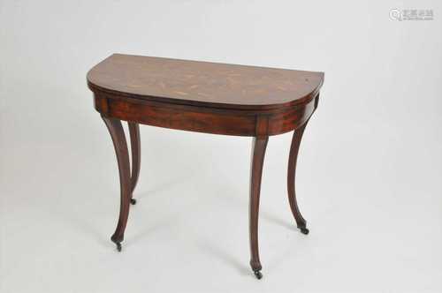 An early 19th century Dutch marquetry tea table, the rounded rectangular top, decorated with