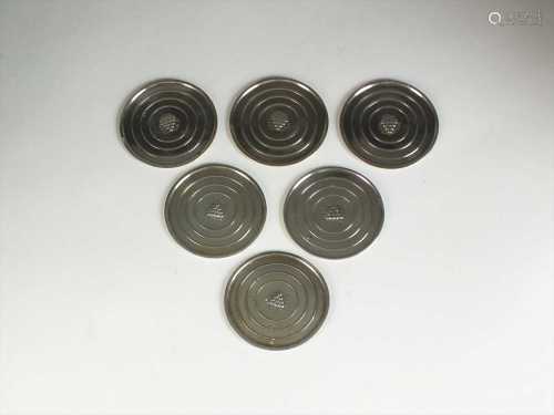 A set of four Georg Jensen small silver coasters