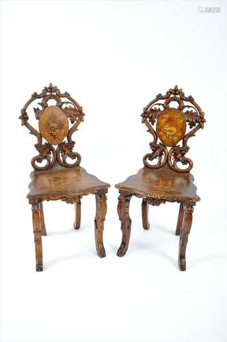 A pair of Black Forrest type 19th century continental hall chairs