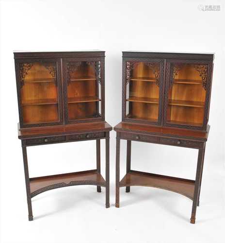 A pair of Edwardian mahogany Chippendale revival cabinets