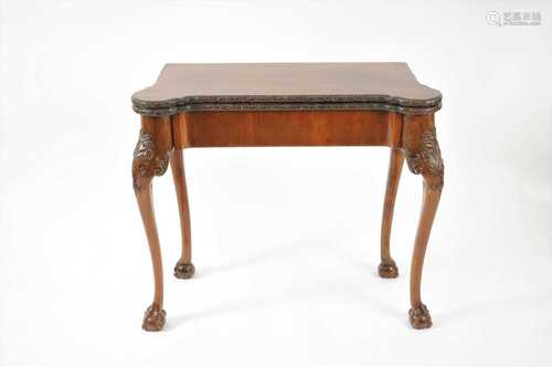 A 19th century folding mahogany card table in the George II style