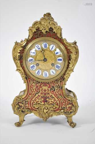 A late 19th century parquetry inlaid boulle mantel clock in the Louis XV style