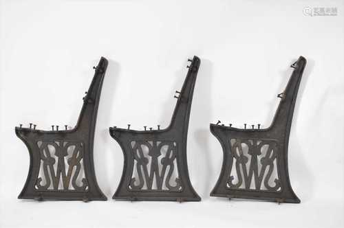 A trio of GWR (Great Western Railway) cast iron bench ends