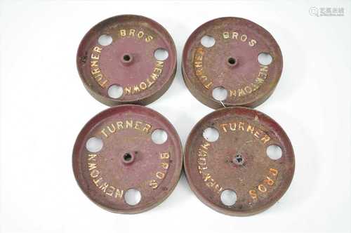 Four small 20th century carriage railway cast iron wheels, 'Turner bros, Newtown'