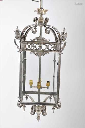 A large, decorative chrome porch lantern in the George III style