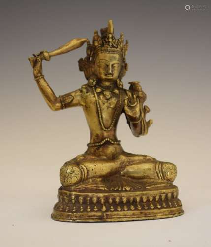 Sino-Tibetan bronze figure of Manjusri, seated in Dhyana Sana, the left hand in vitarka mudra, on