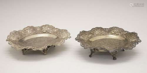 Pair of Middle Eastern white metal dishes, with engraved decoration, the rim having embossed and