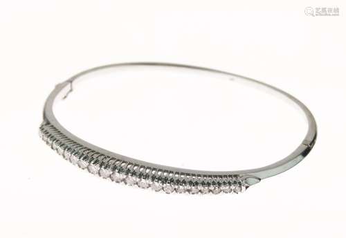 Diamond set hinged bangle, in 18ct white gold, the graduated stones totalling approximately 0.8