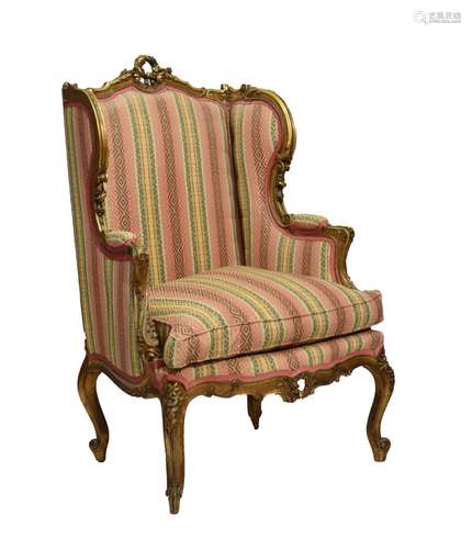 Louis XV-style giltwood wing-back fauteuil or occasional chair, the shaped padded back with