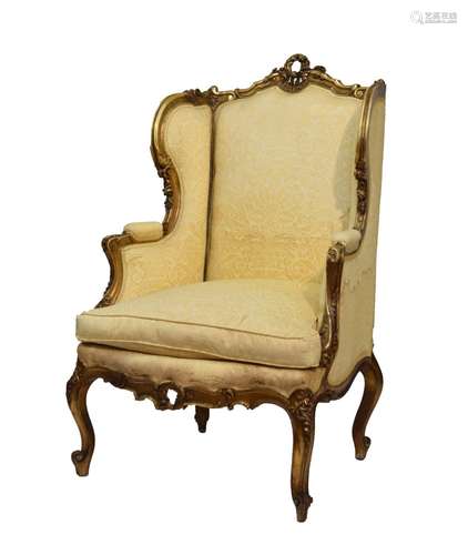 Louis XV-style giltwood wing-back fauteuil or occasional chair, the shaped padded back with