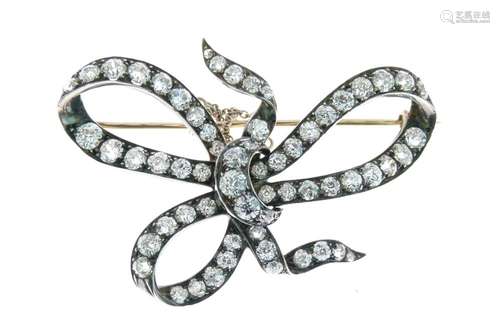 Late Victorian diamond bow brooch, set with sixty-two old brilliant and rose cut diamonds, totalling