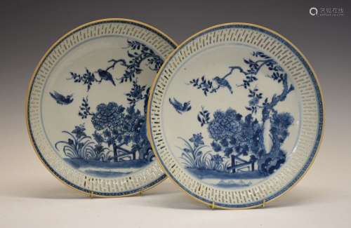 Pair of Chinese blue and white porcelain dishes, each of circular form with reticulated borders,