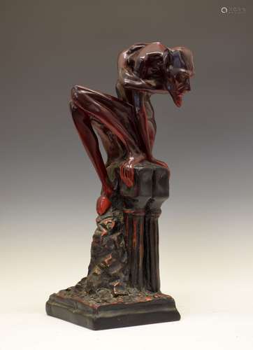 Unusual large early to mid 20th Century earthenware figure of devil, modelled seated atop a pedestal