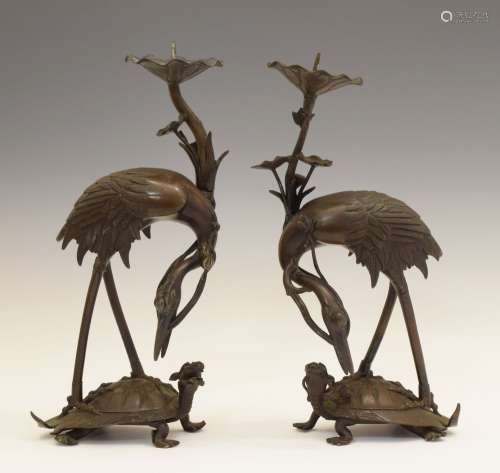 Pair of Japanese Meiji period bronze figural pricket candlesticks, modelled as cranes standing