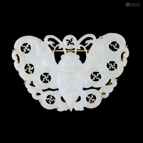 Jade carved and pierced butterfly brooch, the frame stamped 'K18', 6.7cm across, 18.3g gross