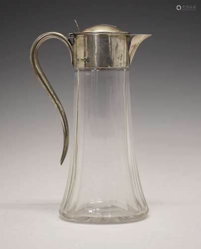 Late Victorian silver-mounted cut glass claret jug, of tapering oval section with hinged domed