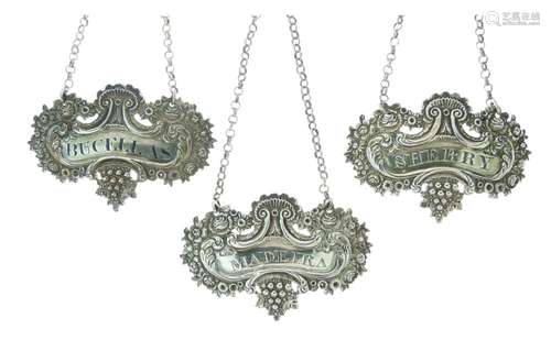 Pair of George III silver spirit labels for Madeira and Bucellas, each with fruiting vine border,