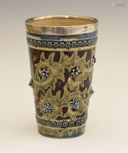 George Tinworth for Doulton Lambeth - A silver-mounted stoneware lemonade beaker, the silver rim