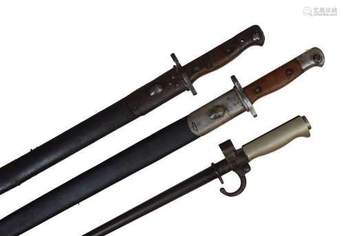 Two United Kingdom pattern 1907 bayonets, one by Wilkinson with crown over 1907, in its scabbard,