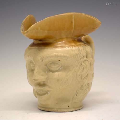 Unusual late 18th/early 19th Century two-tone stoneware character jug, possibly Brampton, with