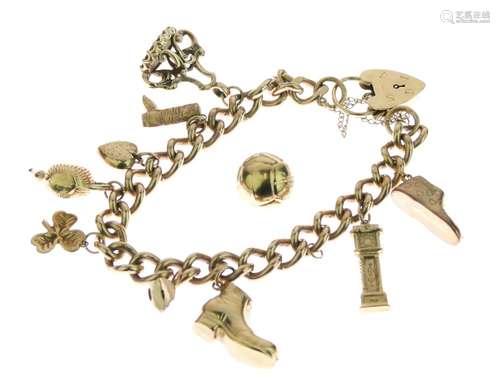 9ct gold bracelet of solid curb links, with charms attached, 47g gross Condition: Various charms