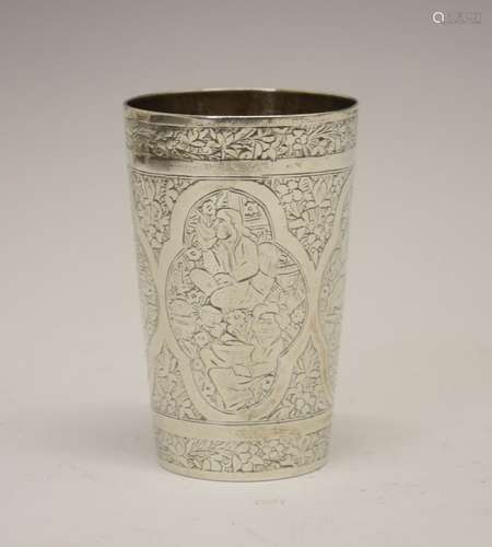 Indian white metal beaker of tapering cylindrical form decorated with quatrefoil panels of