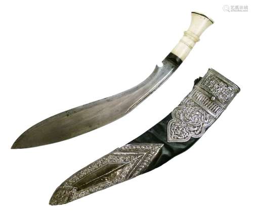 Silver mounted Nepalese Kukri, late 19th Century, with single edged leaf shaped blade with two