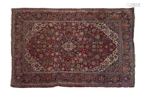 Early 20th Century Middle Eastern (Persian) carpet, the brick-red field with central ogee