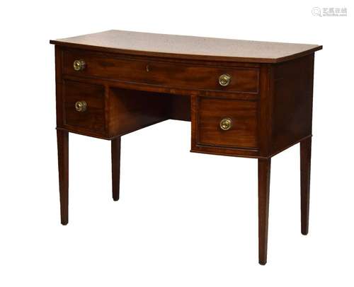 19th Century mahogany bowfront dressing table or kneehole desk, the top with reeded edge over curved