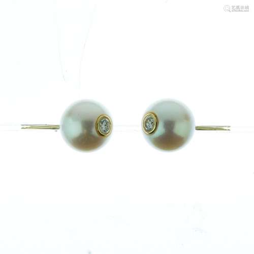 Pair of cultured pearl and diamond earstuds, the 9mm pearls drilled and set to the centre with a