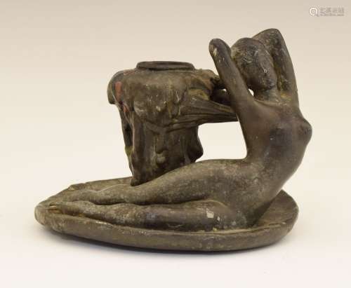French Art Nouveau lead figural chamber candlestick, the handle cast as a reclining naked female,