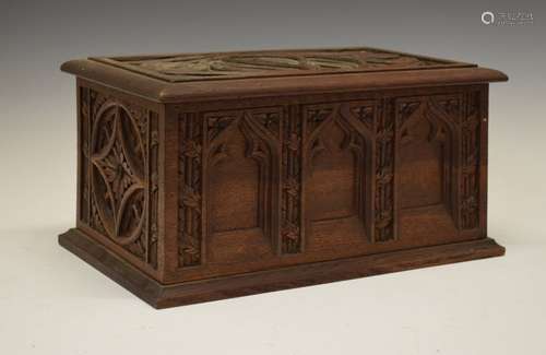 Late 19th/early 20th Century carved oak box, the hinged rectangular cover with Ecclesiastical-