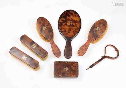 Early 20th Century tortoiseshell dressing table set, comprising oblong box, 12cm wide, pair of