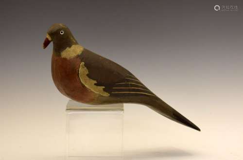 Painted wooden decoy modelled as a Pigeon, probably early 20th Century, with glass eyes and