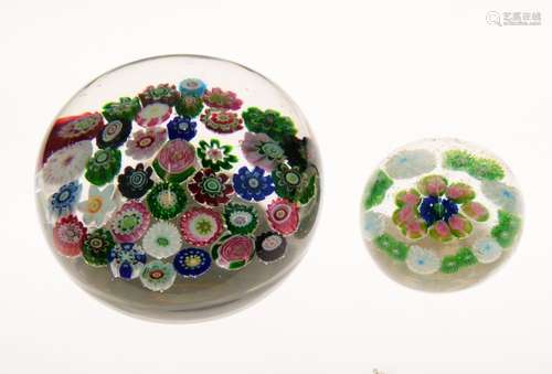 Spaced millefiori paperweight attributed to Clichy, having two 'Clichy' roses to the clear ground,