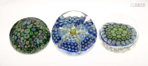 Three assorted paperweights comprising: a millefiori example with unusual emerald green and silver