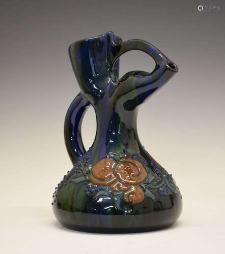 Elton Ware jug, with stylised spout, having foliate decoration on a green and blue ground, mark to