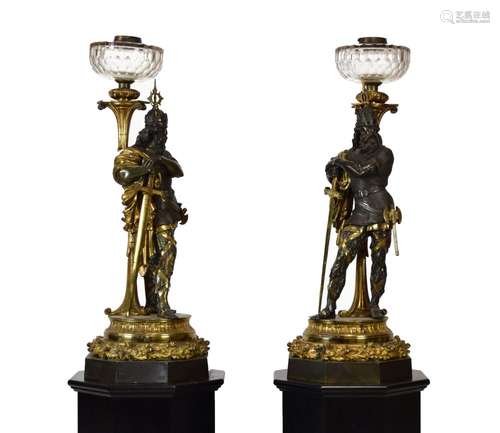 Two monumental late 19th Century cast bronze and ormolu figural lamps, each modelled as a warrior