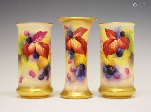 Three Royal Worcester porcelain vases decorated by Kitty Blake, comprising a pair of bulging