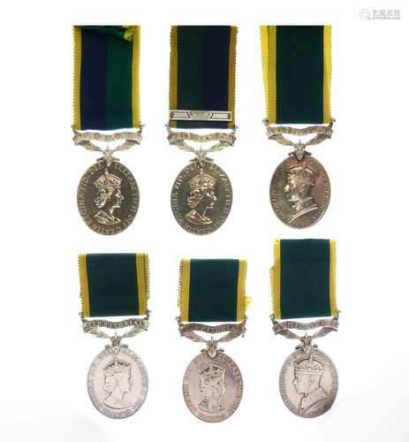 Four Elizabeth II Territorial Efficiency Medals awarded to 5619072 TPR C Granger of the Royal