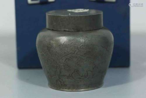 A Chinese Carved Tin Can