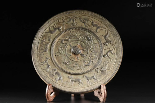 A CHINESE ARCHAIC MIRROR, TANG DYNASTY