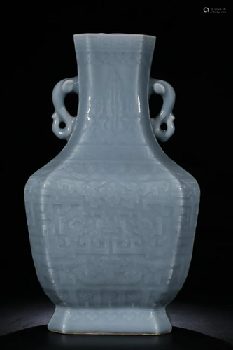 A CHINESE PALE BLUE-GLAZED CARVED â€˜DRAGO…