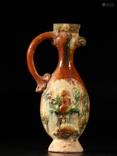 A CHINESE SANCAI-GLAZED POTTERY WINE EWE…